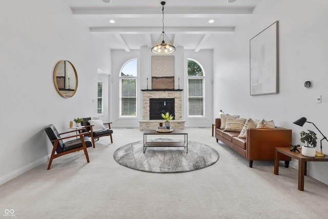 9877 Wading Crane Ave, Fishers, IN 46055 - living room featuring carpet, beam ceiling, and a fireplace