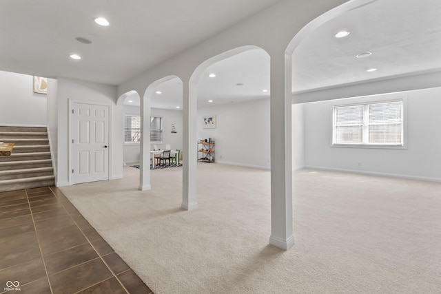 9877 Wading Crane Ave, Fishers, IN 46055 - basement featuring recessed lighting, stairs, carpet floors, tile patterned flooring, and arched walkways