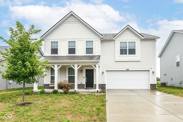 4309 Maize Ln, Whitestown, IN 46075 - view of front of home with board and batten siding, a porch, a garage, concrete driveway, and a front yard