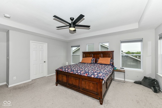 4309 Maize Ln, Whitestown, IN 46075 - bedroom with a raised ceiling, light colored carpet, and a ceiling fan