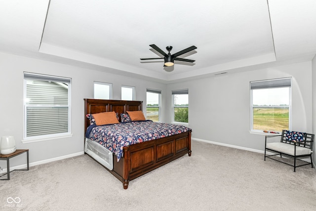 4309 Maize Ln, Whitestown, IN 46075 - bedroom with a raised ceiling, light colored carpet, and a ceiling fan