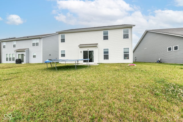 4309 Maize Ln, Whitestown, IN 46075 - rear view of house with a trampoline and a yard