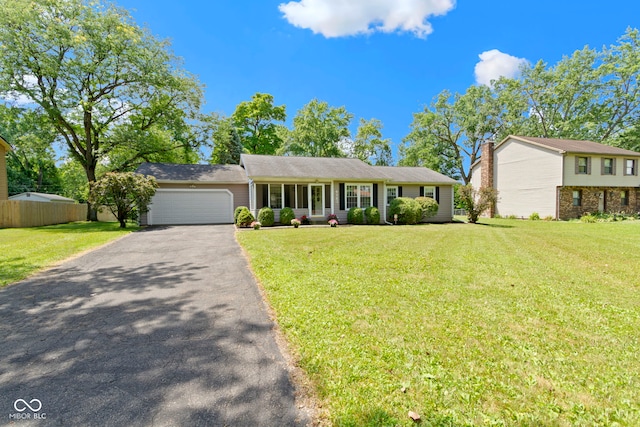 4143 E 61st St, Indianapolis, IN 46220 - view of front of property featuring a garage and driveway