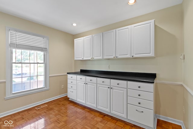 4143 E 61st St, Indianapolis, IN 46220 - kitchen with white cabinets, dark countertops, and recessed lighting