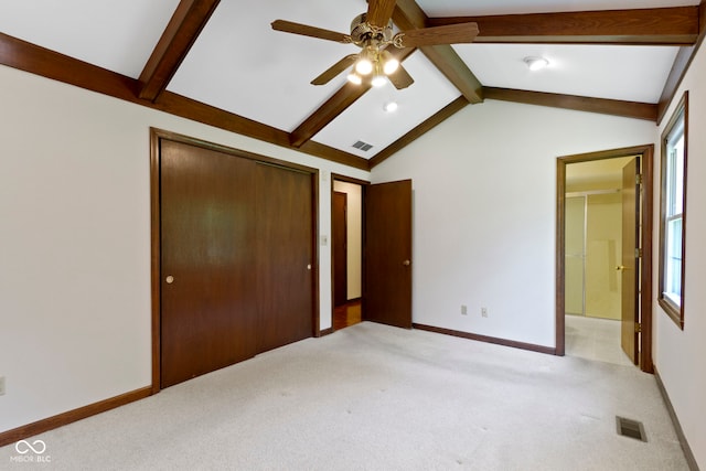 4143 E 61st St, Indianapolis, IN 46220 - unfurnished bedroom featuring light colored carpet, a closet, ensuite bathroom, and ceiling fan