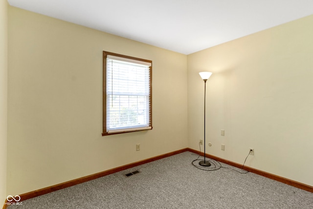 4143 E 61st St, Indianapolis, IN 46220 - empty room featuring carpet flooring and baseboards