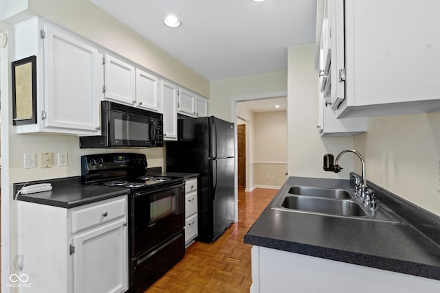 4143 E 61st St, Indianapolis, IN 46220 - kitchen with black appliances, white cabinetry, dark countertops, and recessed lighting