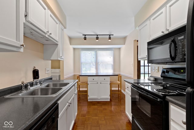 4143 E 61st St, Indianapolis, IN 46220 - kitchen with black appliances, white cabinetry, dark countertops, and plenty of natural light