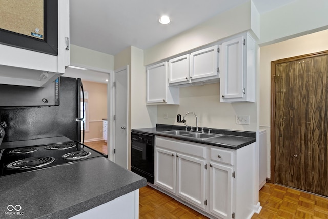 4143 E 61st St, Indianapolis, IN 46220 - kitchen featuring black appliances, dark countertops, white cabinetry, and recessed lighting