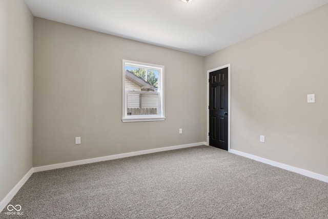 902 Woodrow Ave, Indianapolis, IN 46241 - spare room with carpet flooring and baseboards