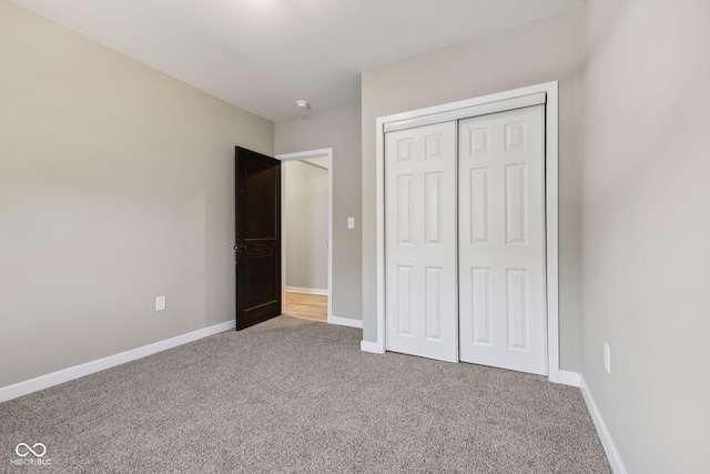 902 Woodrow Ave, Indianapolis, IN 46241 - unfurnished bedroom with carpet flooring and a closet