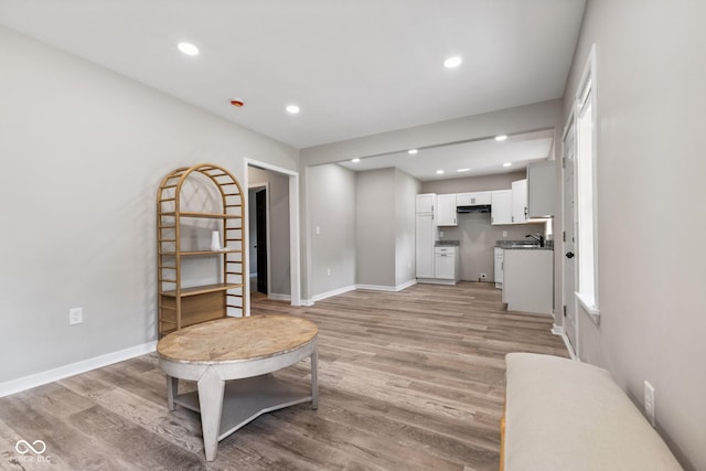 902 Woodrow Ave, Indianapolis, IN 46241 - living area featuring light wood-type flooring and recessed lighting