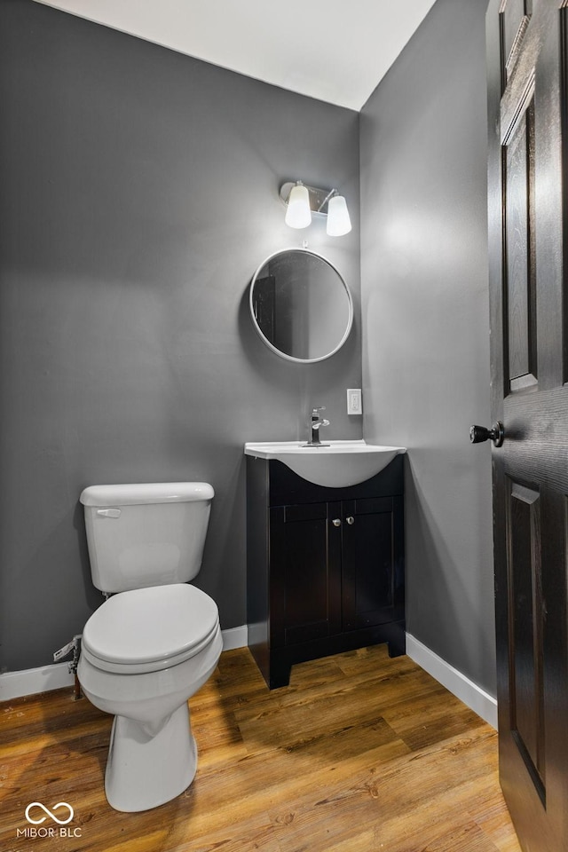 902 Woodrow Ave, Indianapolis, IN 46241 - bathroom featuring vanity and wood finished floors