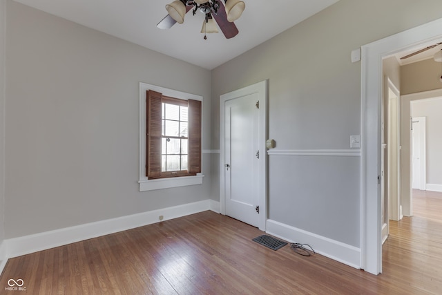 1005 Main St, Beech Grove, IN 46107 - unfurnished room with ceiling fan and wood finished floors