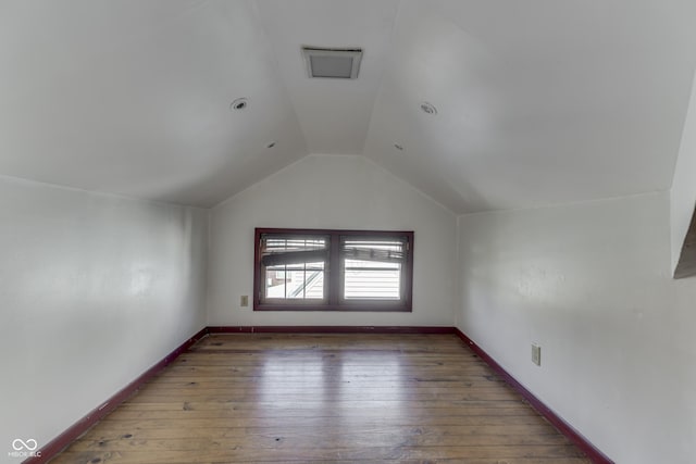 1005 Main St, Beech Grove, IN 46107 - additional living space with vaulted ceiling and hardwood / wood-style floors
