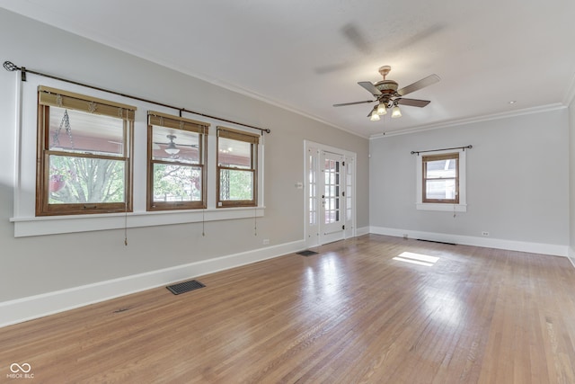 1005 Main St, Beech Grove, IN 46107 - empty room featuring a ceiling fan, ornamental molding, and light wood-style floors
