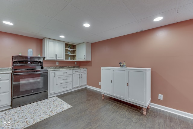 1005 Main St, Beech Grove, IN 46107 - kitchen with black / electric stove, open shelves, dark wood finished floors, a drop ceiling, and white cabinetry