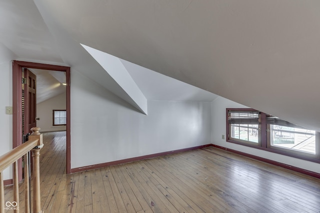 1005 Main St, Beech Grove, IN 46107 - additional living space featuring lofted ceiling, light wood-type flooring, and plenty of natural light