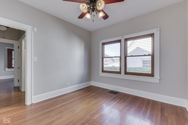 1005 Main St, Beech Grove, IN 46107 - unfurnished room featuring a ceiling fan, healthy amount of natural light, and light wood-type flooring