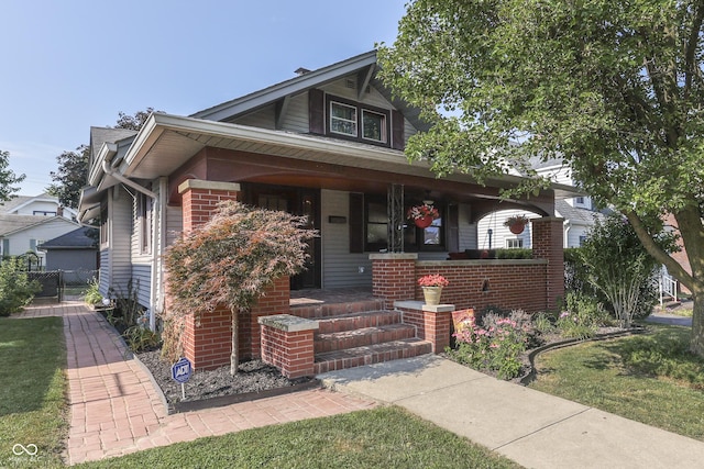 1005 Main St, Beech Grove, IN 46107 - bungalow-style home featuring covered porch and brick siding