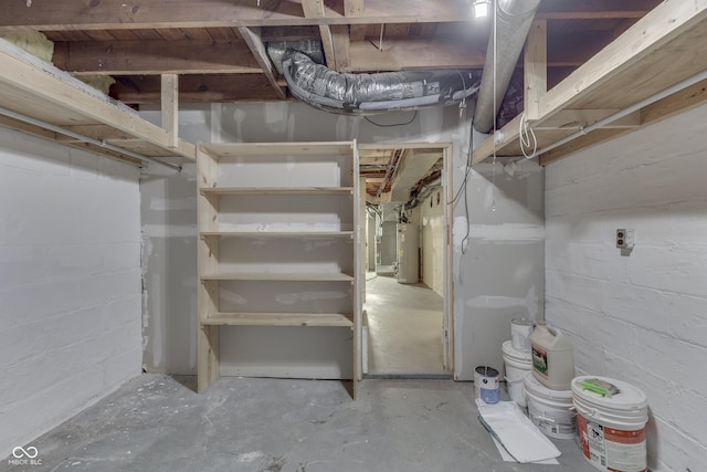 1005 Main St, Beech Grove, IN 46107 - unfinished basement with water heater and concrete block wall