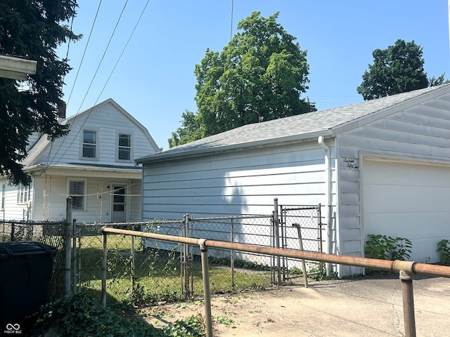 1652 High St, Fort Wayne, IN 46808 - view of front of property with a garage and a shingled roof