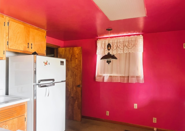 1652 High St, Fort Wayne, IN 46808 - kitchen featuring freestanding refrigerator, light countertops, and concrete floors
