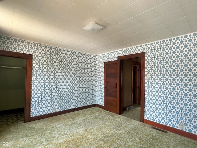 1652 High St, Fort Wayne, IN 46808 - spare room featuring wallpapered walls and carpet flooring