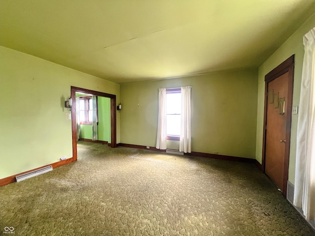 1652 High St, Fort Wayne, IN 46808 - carpeted empty room with healthy amount of natural light and baseboard heating