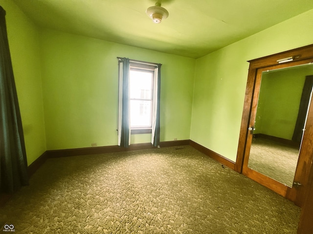 1652 High St, Fort Wayne, IN 46808 - carpeted empty room with baseboards