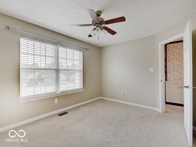 3902 Jekyll Ct, Indianapolis, IN 46237 - empty room featuring carpet flooring, ceiling fan, and a textured ceiling