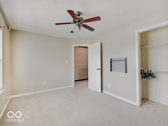 3902 Jekyll Ct, Indianapolis, IN 46237 - unfurnished bedroom featuring carpet, a closet, and a ceiling fan