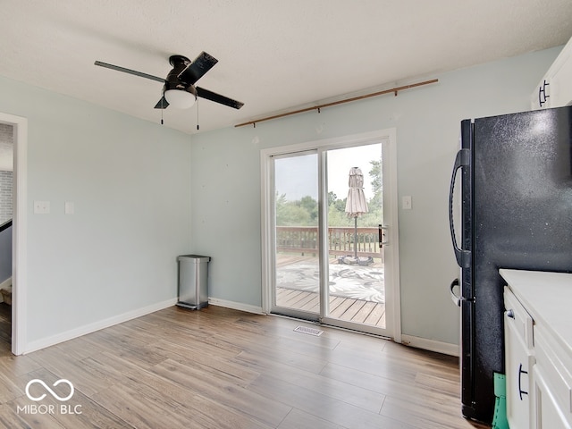 3902 Jekyll Ct, Indianapolis, IN 46237 - unfurnished living room featuring light wood finished floors and ceiling fan