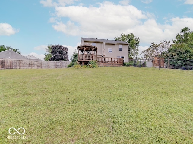 3902 Jekyll Ct, Indianapolis, IN 46237 - back of property with a gazebo, a fenced backyard, and a wooden deck