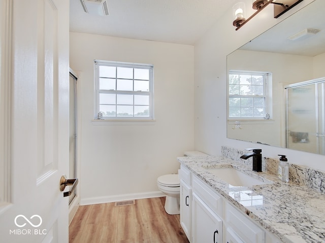 3902 Jekyll Ct, Indianapolis, IN 46237 - full bath featuring vanity, a stall shower, and wood finished floors