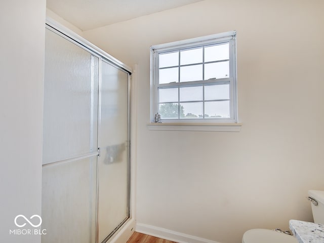 3902 Jekyll Ct, Indianapolis, IN 46237 - full bath with a shower with shower door and wood finished floors
