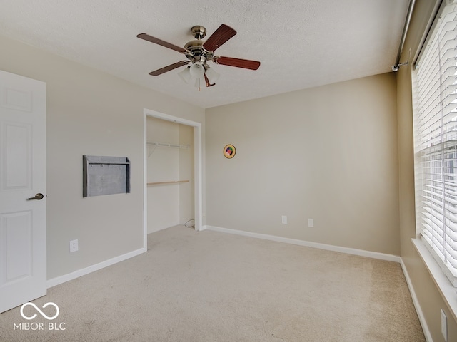 3902 Jekyll Ct, Indianapolis, IN 46237 - unfurnished bedroom with light carpet, a closet, a ceiling fan, and a textured ceiling