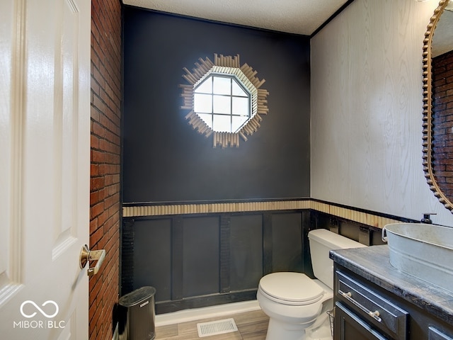 3902 Jekyll Ct, Indianapolis, IN 46237 - half bath with vanity, wood finished floors, and wainscoting
