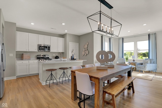 948 Shadow Dr, Danville, IN 46122 - dining room featuring light wood-style floors, recessed lighting, and a chandelier