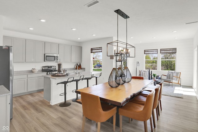 924 Shadow Dr, Danville, IN 46122 - dining space with plenty of natural light, light wood finished floors, a chandelier, and recessed lighting