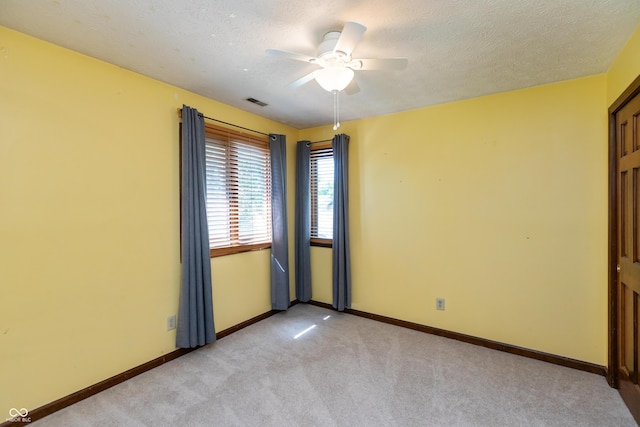 6926 Princess Ln, Avon, IN 46123 - empty room with light carpet, ceiling fan, and a textured ceiling