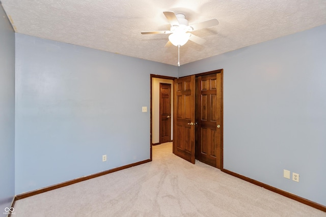 6926 Princess Ln, Avon, IN 46123 - unfurnished room with ceiling fan, light colored carpet, and a textured ceiling