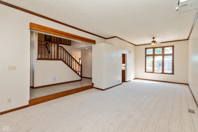 6926 Princess Ln, Avon, IN 46123 - unfurnished living room featuring carpet flooring, a ceiling fan, crown molding, and stairway