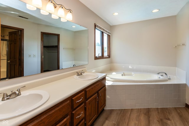 6926 Princess Ln, Avon, IN 46123 - full bath with a garden tub, double vanity, wood finished floors, and recessed lighting