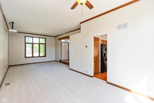 6926 Princess Ln, Avon, IN 46123 - empty room featuring light colored carpet, ceiling fan, and ornamental molding