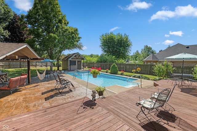 6926 Princess Ln, Avon, IN 46123 - view of swimming pool with a fenced backyard, a deck, and an outbuilding