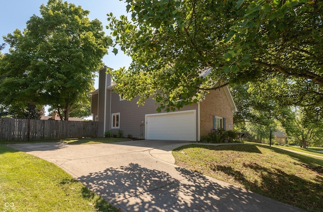 6926 Princess Ln, Avon, IN 46123 - view of home's exterior featuring driveway, brick siding, and a chimney