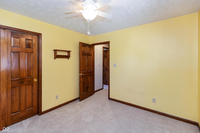 6926 Princess Ln, Avon, IN 46123 - unfurnished bedroom featuring light carpet, a textured ceiling, and a ceiling fan