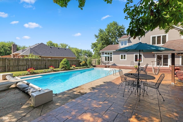6926 Princess Ln, Avon, IN 46123 - view of pool featuring a diving board, a patio area, a fenced backyard, and outdoor dining area