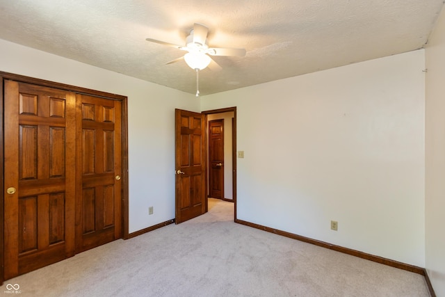 6926 Princess Ln, Avon, IN 46123 - unfurnished bedroom with light colored carpet, a ceiling fan, and a textured ceiling